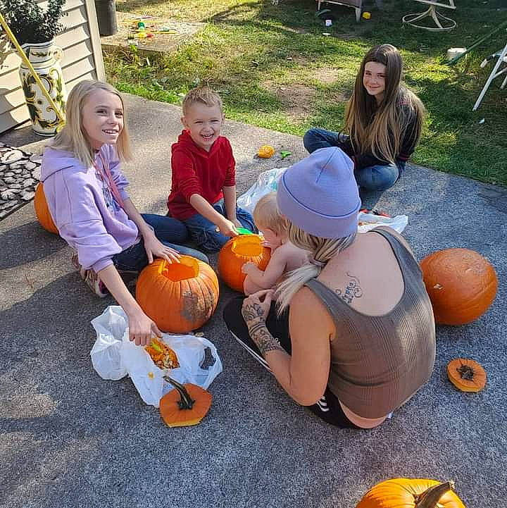 Lilli is registered to the contest to win money with this photo: calabaza, child, cucurbita, event, fun, gourd, grass, jack_o_lantern, joy, leisure, musical_instrument, natural_foods, orange, person, plant, pumpkin, sharing, shorts, squash, trick_or_treat