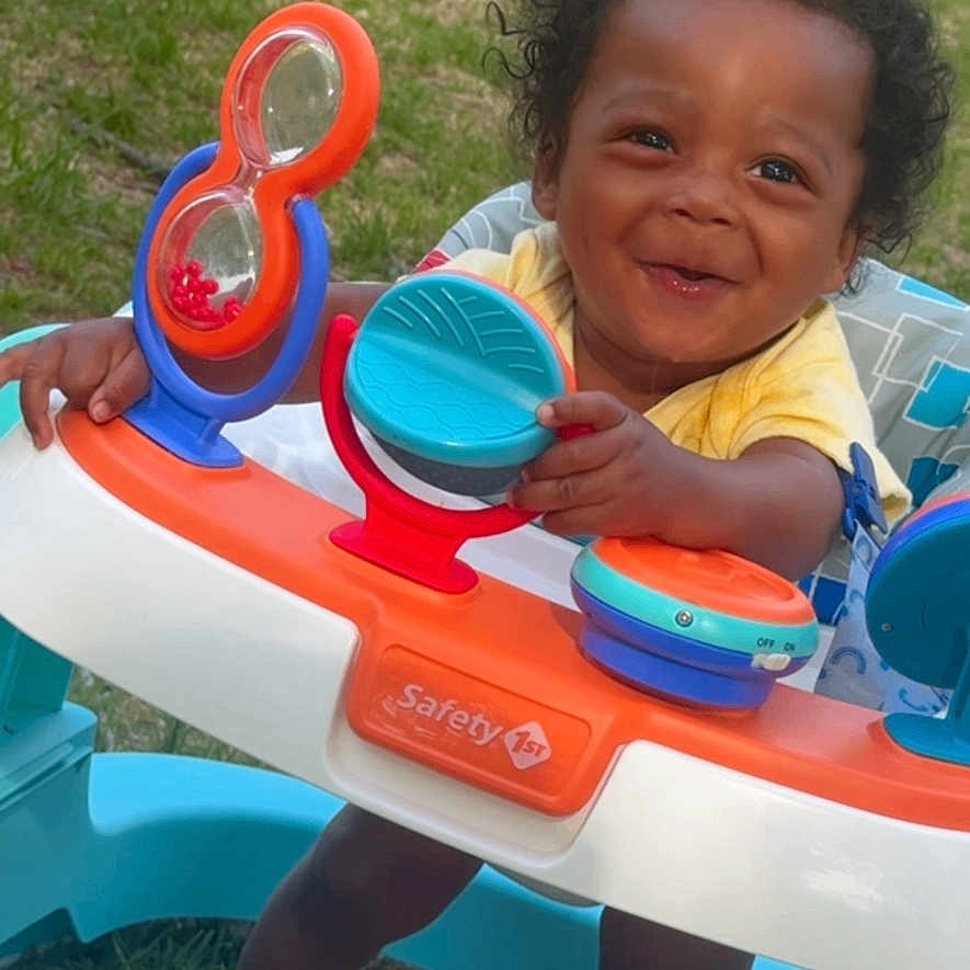 Zhyeed is registered to the contest to win money with this photo: baby, baby_walker, child, childhood, curly_hair, cute, daylight, fun, grass, happy, infant, outdoor, person, playtime, smiling, toddler, toy, walker, white_socks, yellow_shirt