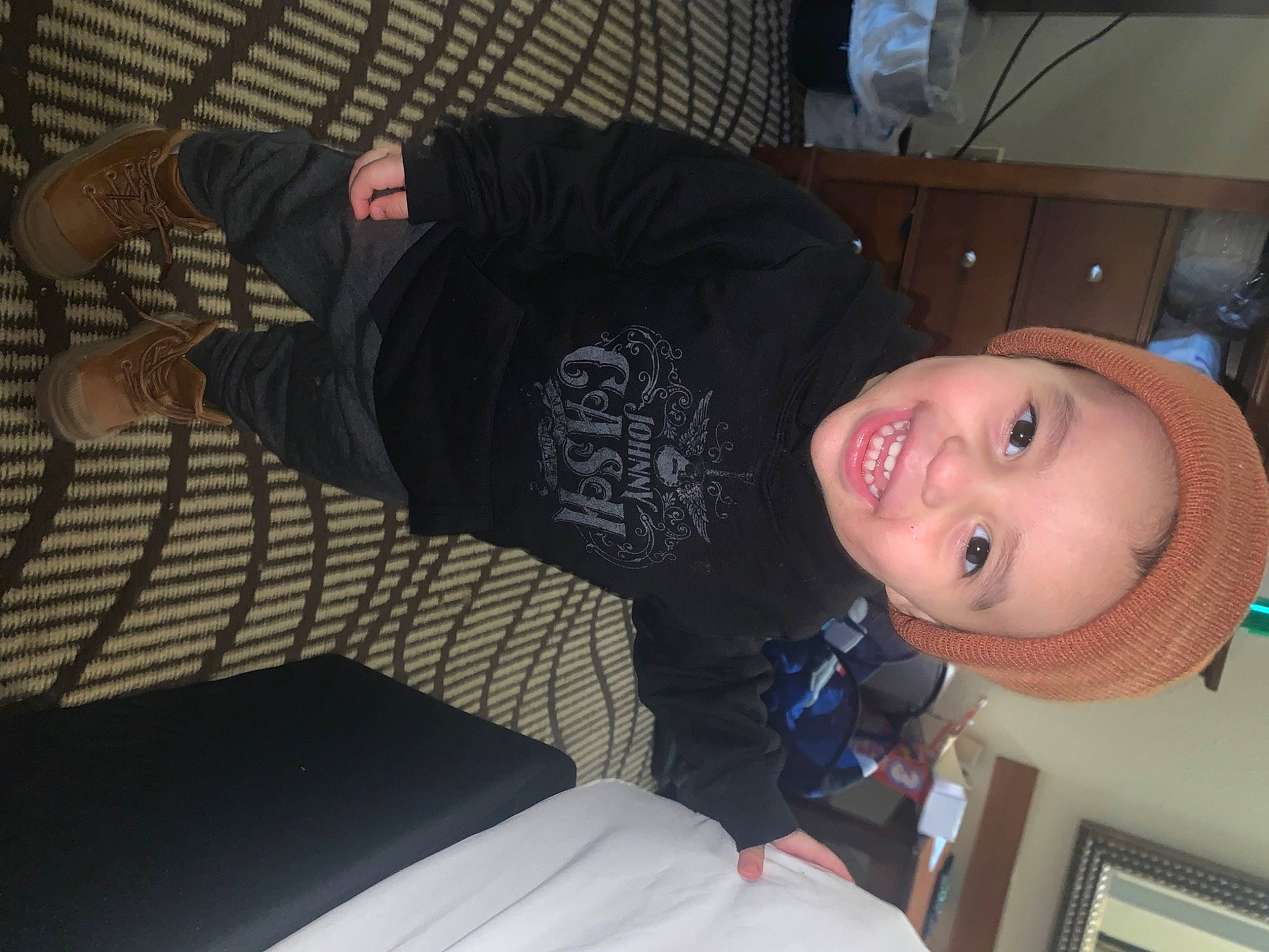 Armani is registered to the contest to win money with this photo: comfort, elbow, fun, house, joy, knee, person, room, sitting, sleeve, smile, t_shirt, thigh, toddler, vertebrate, wrist