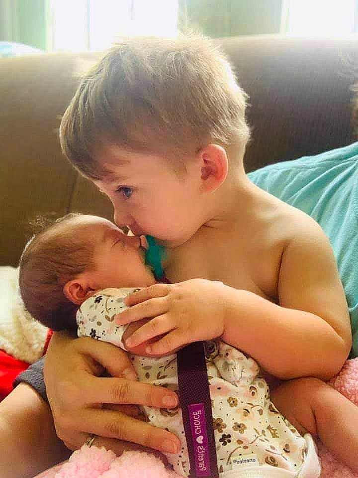 Ace is registered to the contest to win money with this photo: abdomen, baby, baby_toddler_clothing, cheek, chest, child, comfort, couch, event, face, finger, fun, happy, nail, person, sharing, sitting, skin, thumb, toddler