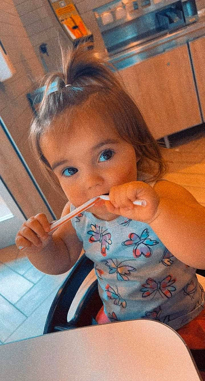 Hazel joined the competition — help win amazing prizes! arm, baby, bathing, chair, cheek, child, drinkware, eyelash, facial_expression, finger, hand, happy, lip, mouth, nose, person, sitting, skin, table, tableware