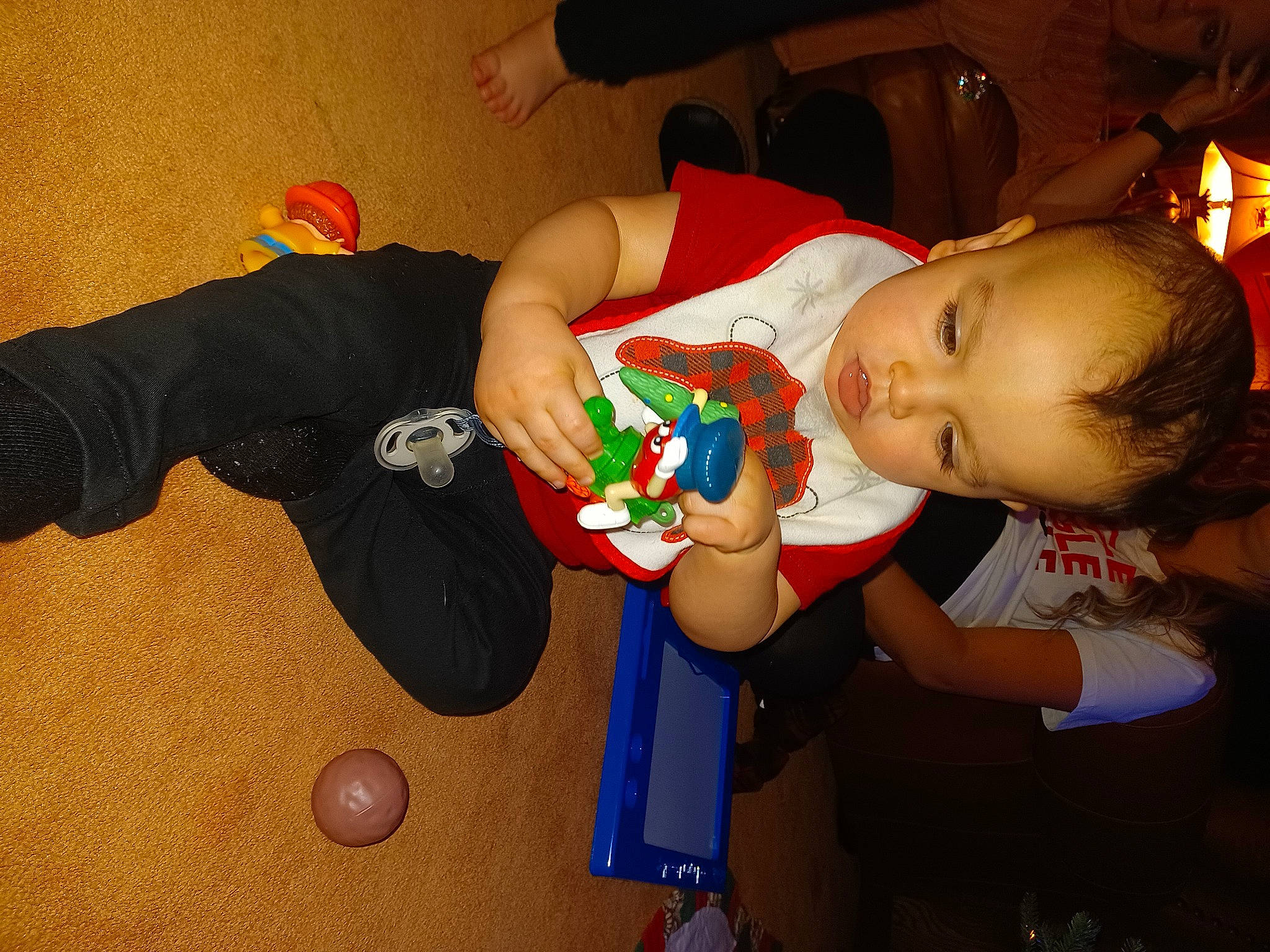 Clay is registered to the contest to win money with this photo: baby, baby_products, baby_toddler_clothing, baby_toys, child, comfort, elbow, event, finger, fun, happy, party, person, play, room, shorts, sitting, t_shirt, toddler, toy