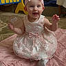 baby, blanket, carpet, celebration, child, cute, dress, girl, happy, headband, indoors, infant, lace, milestone, pink_bow, portrait, sign, sitting, six_months, smiling
