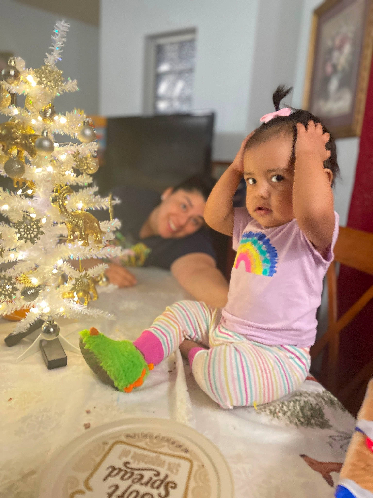 Olyvia joined the competition — help win amazing prizes! baby, baby_toddler_clothing, child, christmas, christmas_decoration, christmas_ornament, christmas_tree, conifer, event, fun, happy, holiday, holiday_ornament, joy, ornament, person, picture_frame, room, sitting, toddler