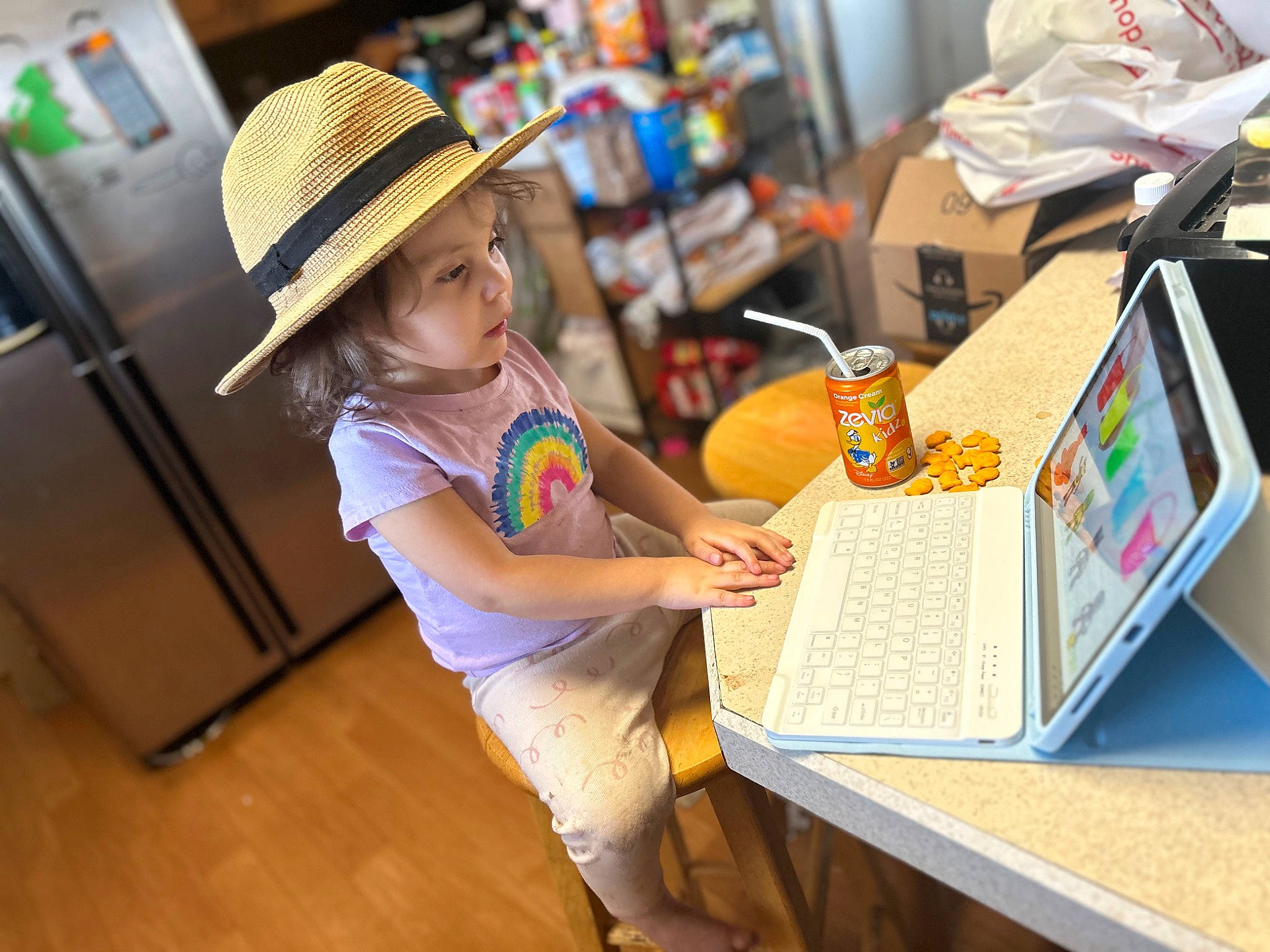 Daisy joined the competition — help win amazing prizes! child, computer, desk, engineering, fedora, flooring, fun, hardwood, hat, headwear, laptop, leisure, office_equipment, office_supplies, person, personal_computer, room, sitting, sun_hat, table
