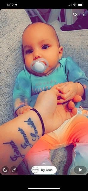 Evelynn is registered to the contest to win money with this photo: arm, azure, baby, baby_toddler_clothing, cheek, comfort, finger, gesture, hand, human_body, joint, knee, mouth, muscle, neck, nose, organ, person, skin, sleeve