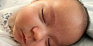 Oliver joined the competition — help win amazing prizes! baby, sleeping, close_up, face, infant, soft, blanket, onesie, animal_print, eyelashes, peaceful, resting, skin, head, cute, newborn, indoors, child, portrait, cozy