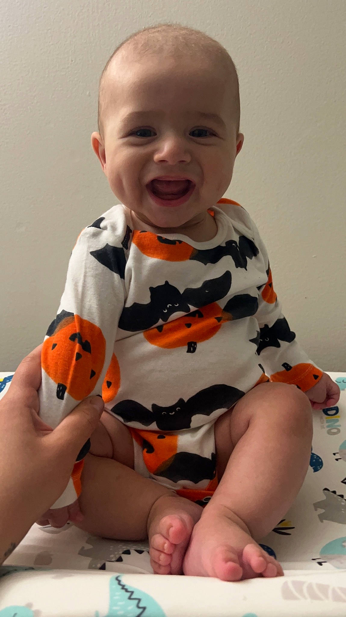 Cohen joined the competition — help win amazing prizes! baby, baby_toddler_clothing, cheek, child, comfort, face, finger, happy, human_body, knee, orange, pattern, person, skin, sleeve, smile, t_shirt, thigh, toddler, white