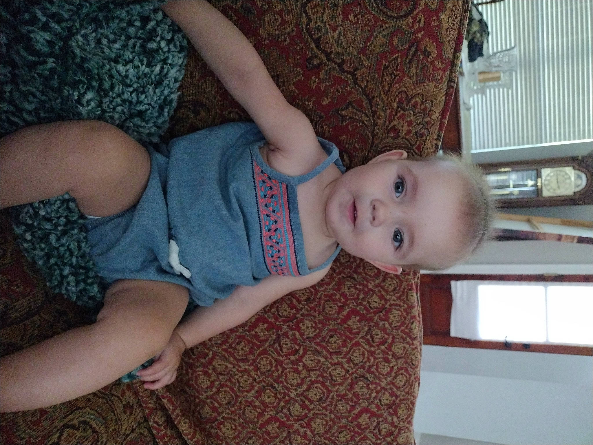 Riverlynn is registered to the contest to win money with this photo: baby, baby_toddler_clothing, child, comfort, eye, face, finger, flooring, fun, human_body, human_leg, joint, knee, leg, person, skin, smile, thigh, toddler, trunk