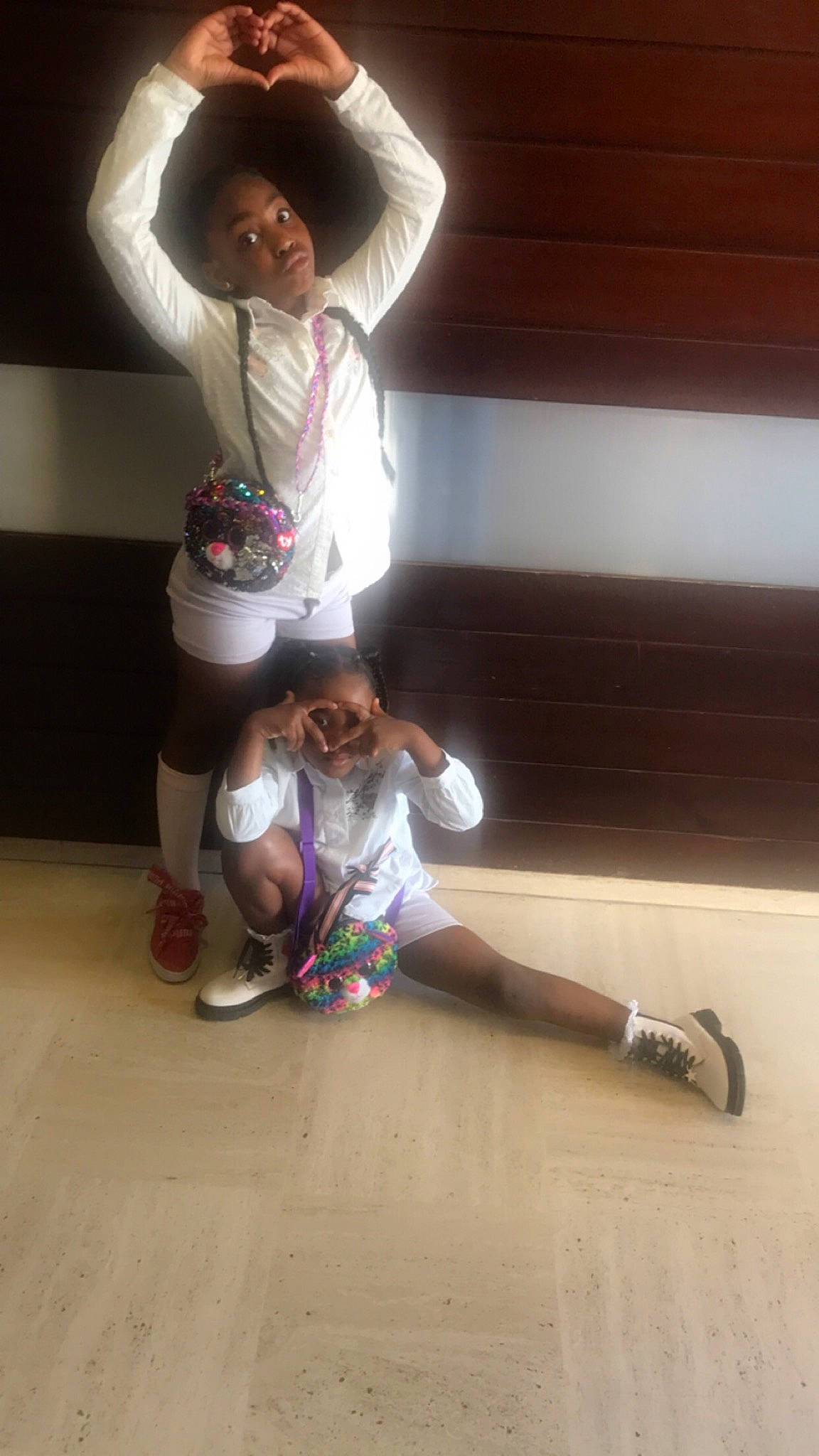 Tia participe au concours pour gagner de l'argent avec cette photo : boot, entertainment, event, flash_photography, floor, flooring, foot, fun, gesture, happy, hardwood, human_leg, knee, leg, leisure, performing_arts, person, shoe, sneakers, thigh