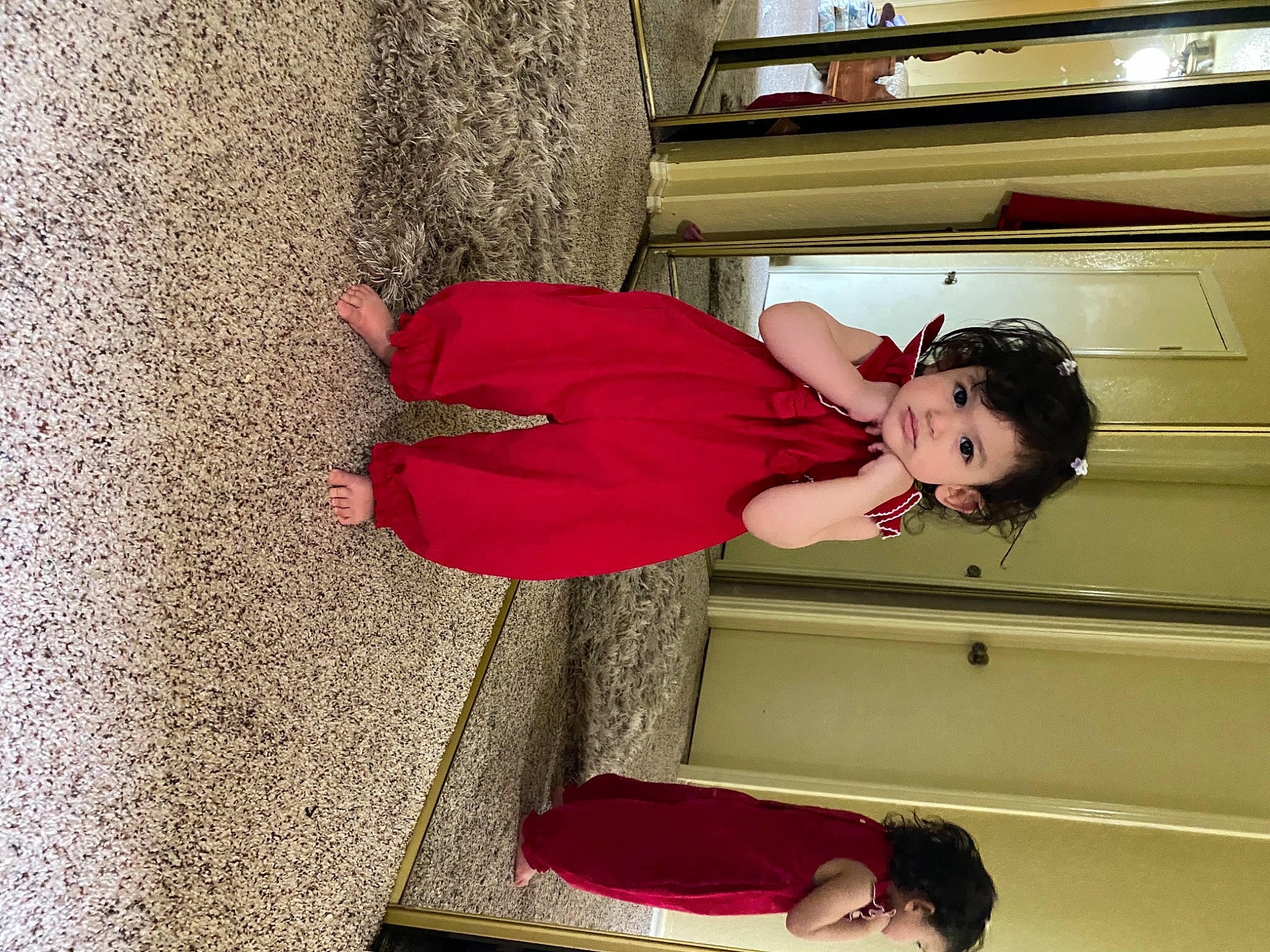 Yasmine is registered to the contest to win money with this photo: arm, clothing, comfort, fun, happy, human_leg, joint, knee, leg, leisure, magenta, person, red, room, shoulder, sitting, snapshot, stairs, thigh, wood