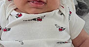 Freddy joined the competition — help win amazing prizes! baby, bedding, blanket, child, close_up, clothing, cozy, eyes, face, happy, home, indoor, infant, onesie, photography, portrait, sitting, smiling, tongue_out, train_pattern