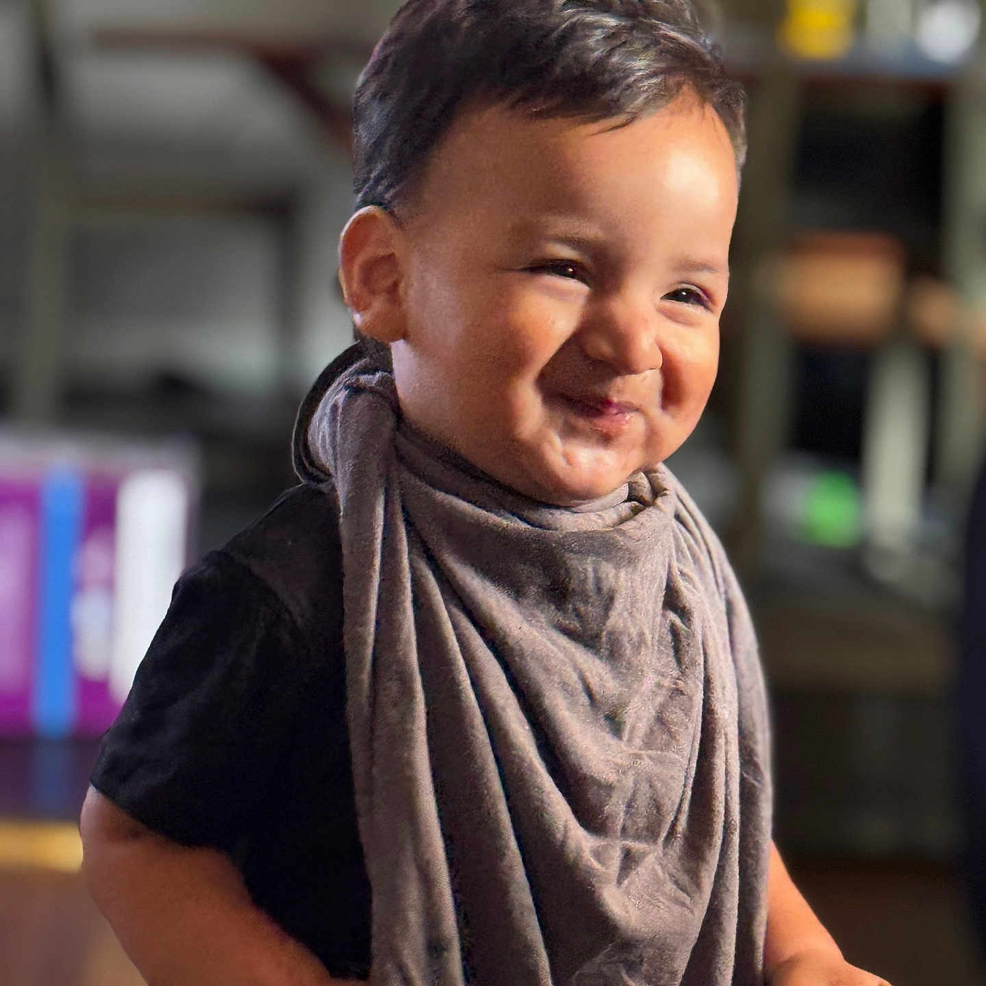 Steve joined the competition — help win amazing prizes! toddler, child, smiling, indoor, scarf, clothing, face, head, person, holding, cone, food, cute, happy, portrait, young, expression, warm, blurred_background, casual
