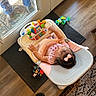 Valentyna is registered to the contest to win money with this photo: baby, baby_seat, blue_jeans, boots, child, colorful_toys, doormat, feet, glass_door, home, indoor, infant, nike_slides, person_outside, pink_bow, play, rug, seated, toy, wooden_floor