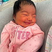 Valentyna joined the competition — help win amazing prizes! baby, newborn, infant, smiling, pink_onesie, blanket, pillow, face, hair, closed_eyes, tiny_hands, cozy, soft_texture, skin, portrait, babywear, newborn_clothes, happy, nap, bed