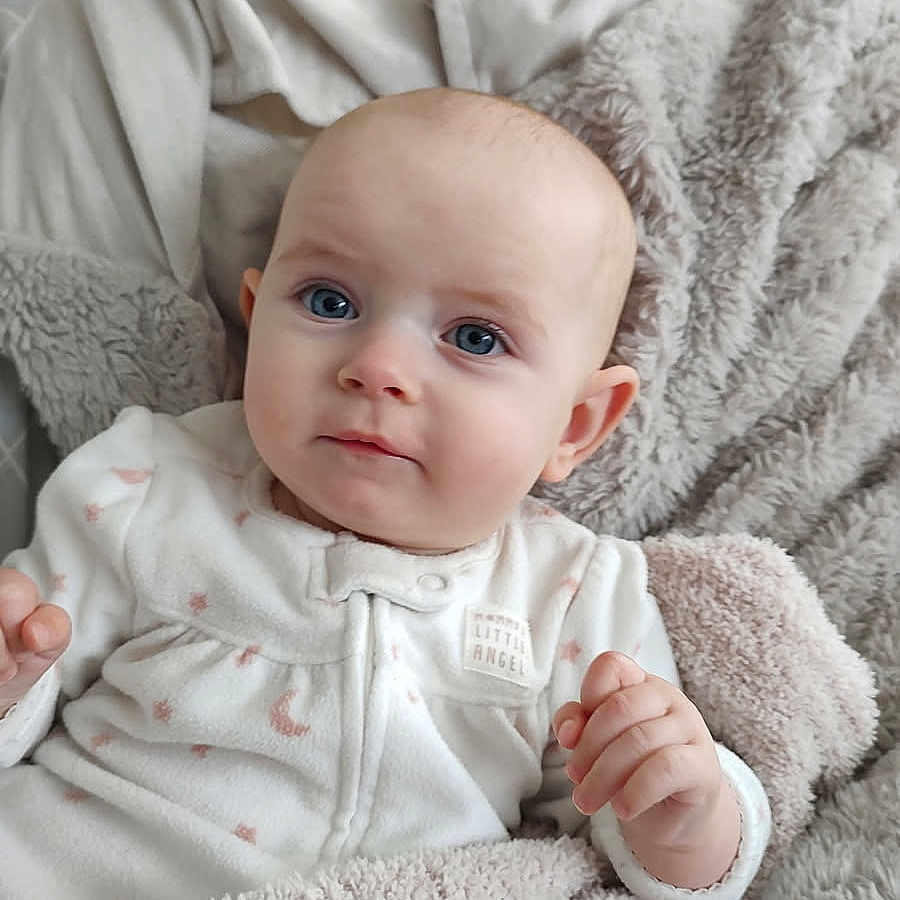 Remy Lou is registered to the contest to win money with this photo: baby, bed, bedroom, blanket, bodypart, cushion, face, finger, furniture, hand, happy, head, homedecor, newborn, person, photography, portrait, quilt, sitting, smile