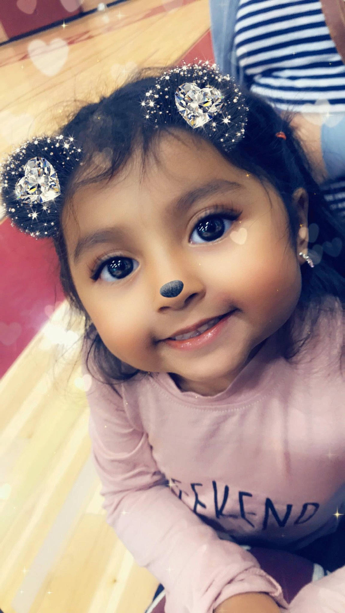 Alison is registered to the contest to win money with this photo: black_hair, cheek, child, child_model, crown, eyebrow, face, fashion_accessory, forehead, hair, hair_accessory, hairstyle, head, headband, headgear, headpiece, joy, person, skin, smile