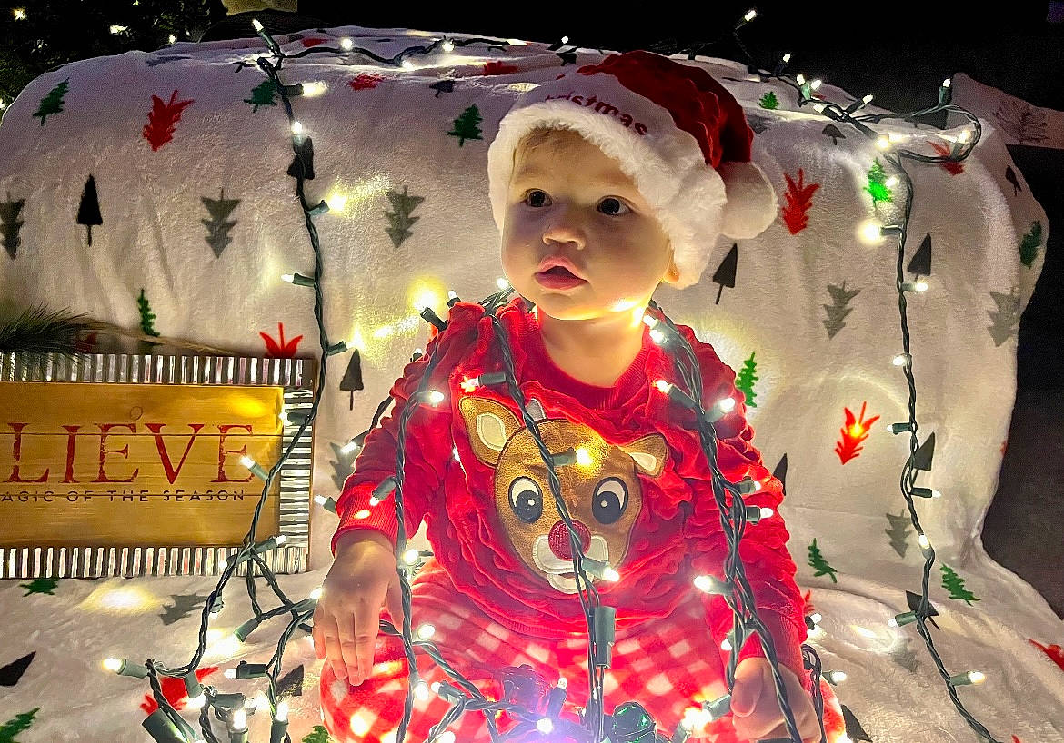 Skylynn is registered to the contest to win money with this photo: baby, baby_toddler_clothing, child, christmas_eve, costume, event, fashion_design, festival, fictional_character, fun, happy, headwear, holiday, magenta, pattern, person, sleeve, toddler, tradition, tree