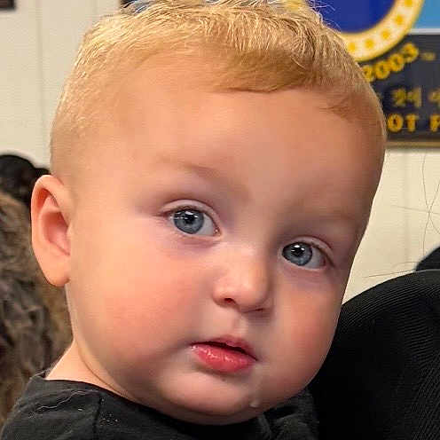 Wesson is registered to the contest to win money with this photo: toddler, child, face, portrait, blonde_hair, blue_eyes, indoor, curious, droplet, black_clothing, young_child, baby, person, cute, head, skin, expression, human, small_child, closeup