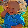 baby, child, smiling, hat, blue_shirt, outdoor, grass, sunlight, portrait, happy, sitting, face, person, summer, cute, infant, clothing, nature, daylight, headwear