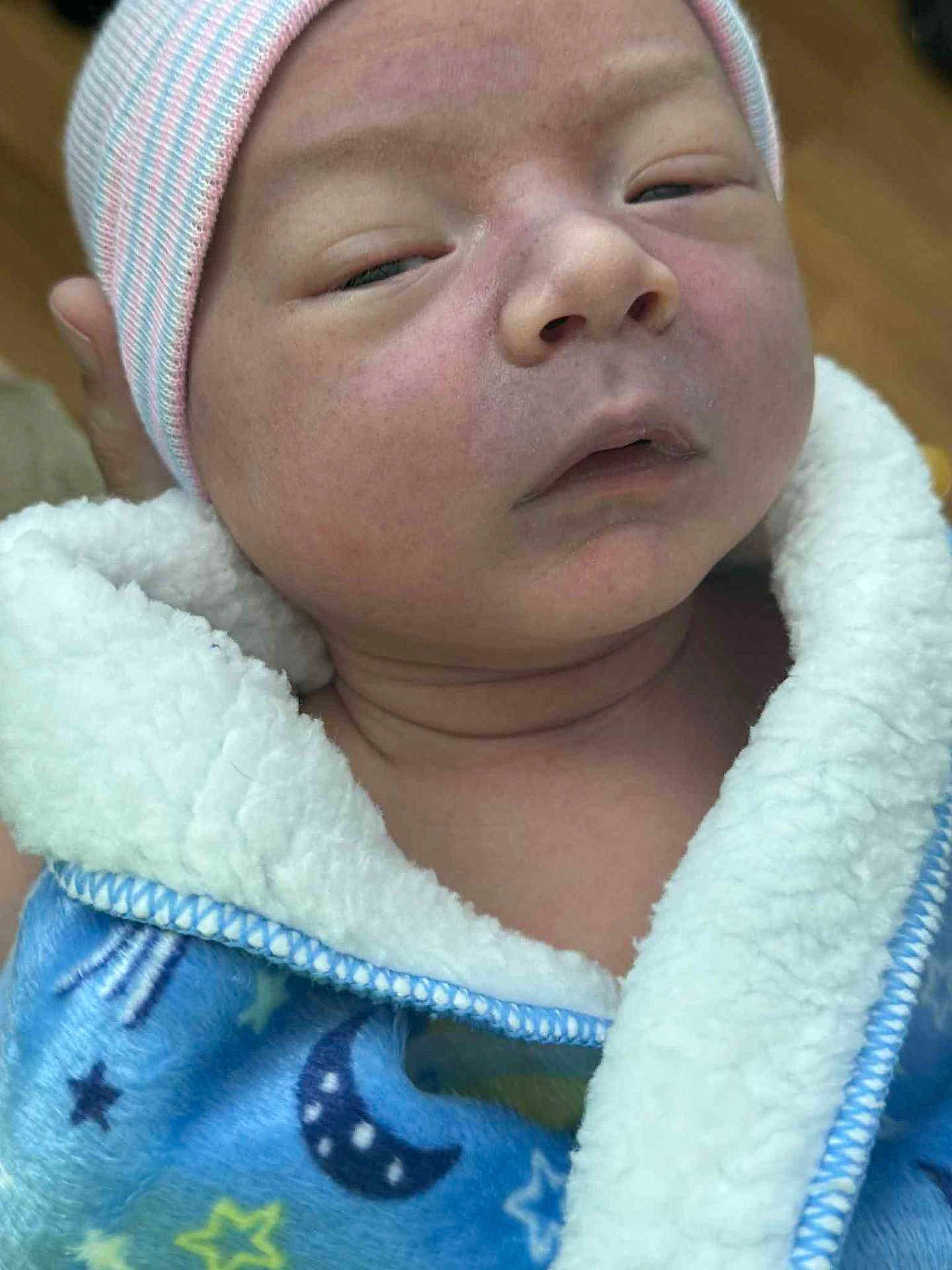 Coljay joined the competition — help win amazing prizes! newborn, baby, face, blanket, hat, sleepy, close_up, infant, cozy, blue, stars, moon, clothing, person, skin, headwear, warm, soft, expression, portrait