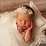 newborn, baby, sleeping, headband, flower, white, fabric, blanket, soft, peaceful, portrait, infant, wrapped, cute, indoors, closeup, delicate, resting, toddler, peace