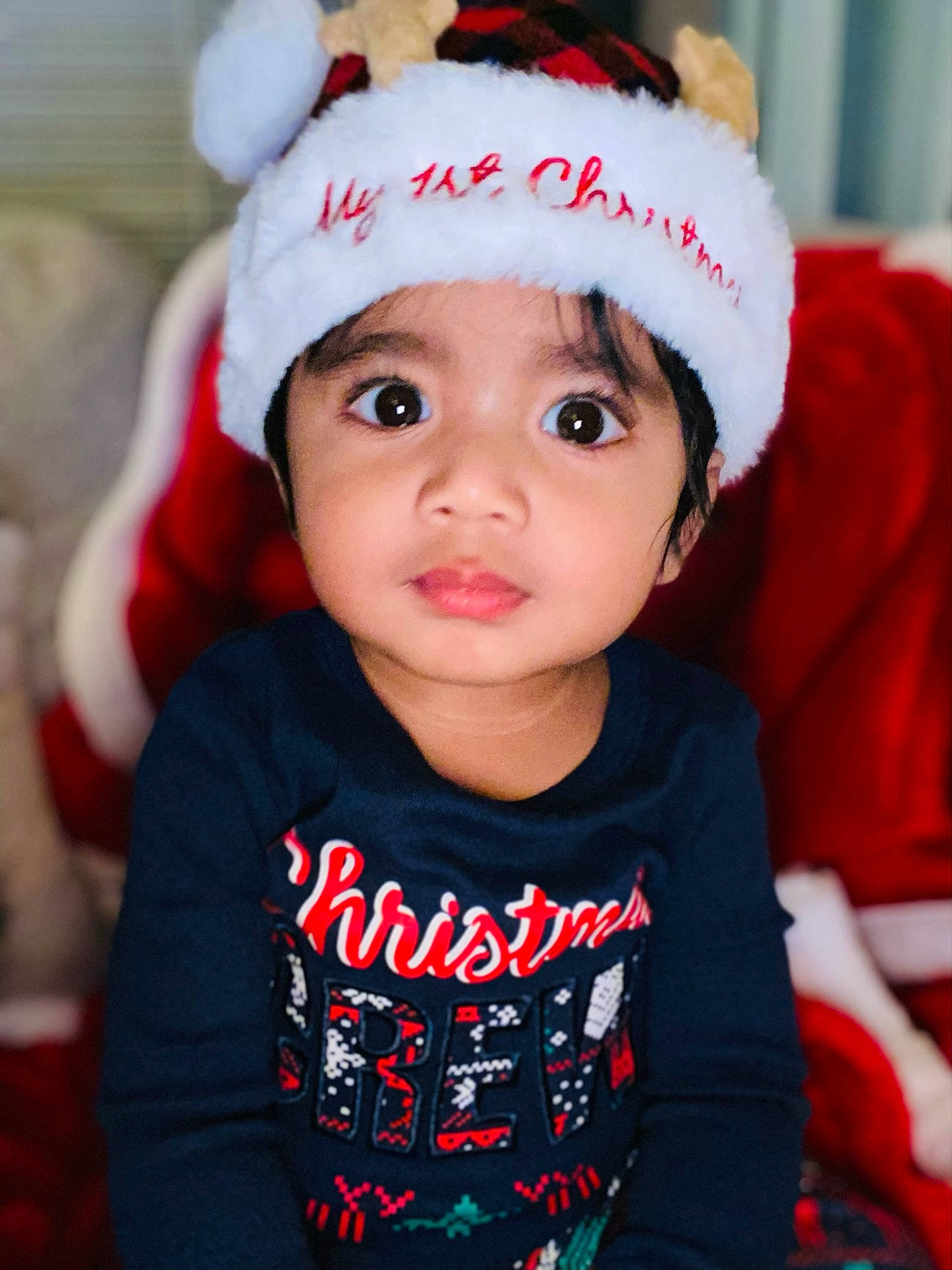 Ari joined the competition — help win amazing prizes! baby, baby_toddler_clothing, cap, child, costume_hat, event, fashion_accessory, fictional_character, fun, happy, hat, head, headgear, headwear, holiday, person, red, sleeve, smile, toddler