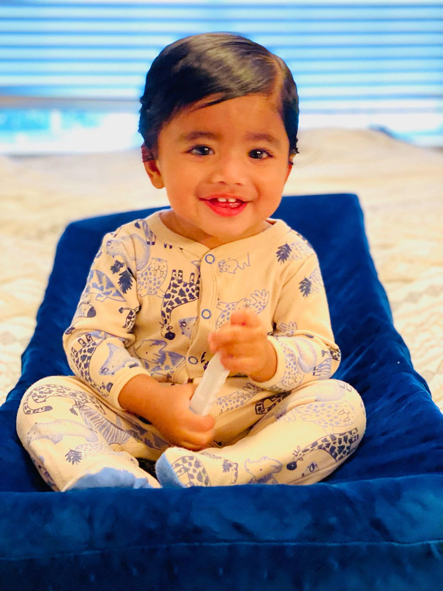 Ari is registered to the contest to win money with this photo: baby, baby_toddler_clothing, cheek, child, comfort, flash_photography, fun, grass, happy, head, human_body, human_leg, joy, leisure, person, play, sitting, skin, sleeve, smile