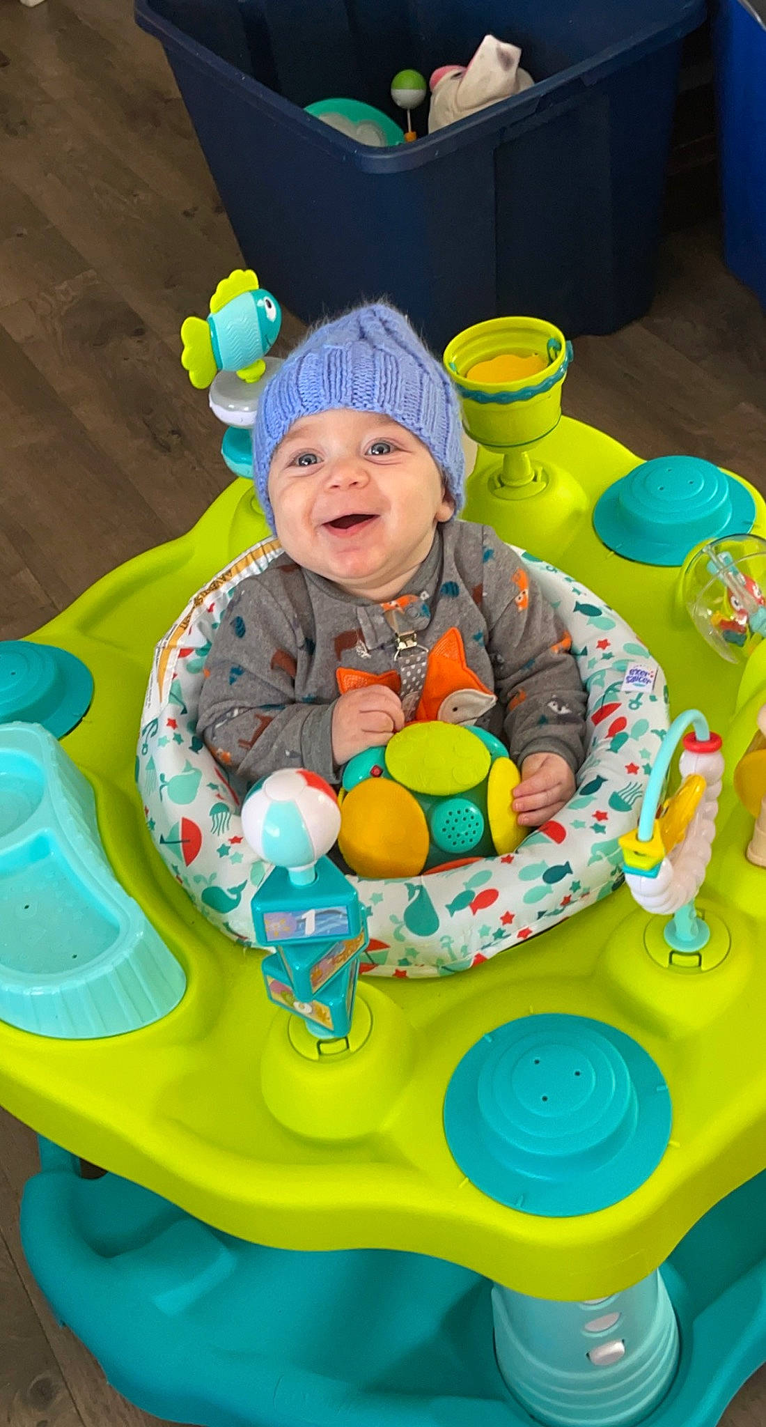 Rodney is registered to the contest to win money with this photo: baby, baby_playing_with_toys, baby_products, baby_toddler_clothing, baby_toys, blue, chair, child, event, fun, green, happy, headwear, leisure, person, play, sitting, smile, stuffed_toy, toddler