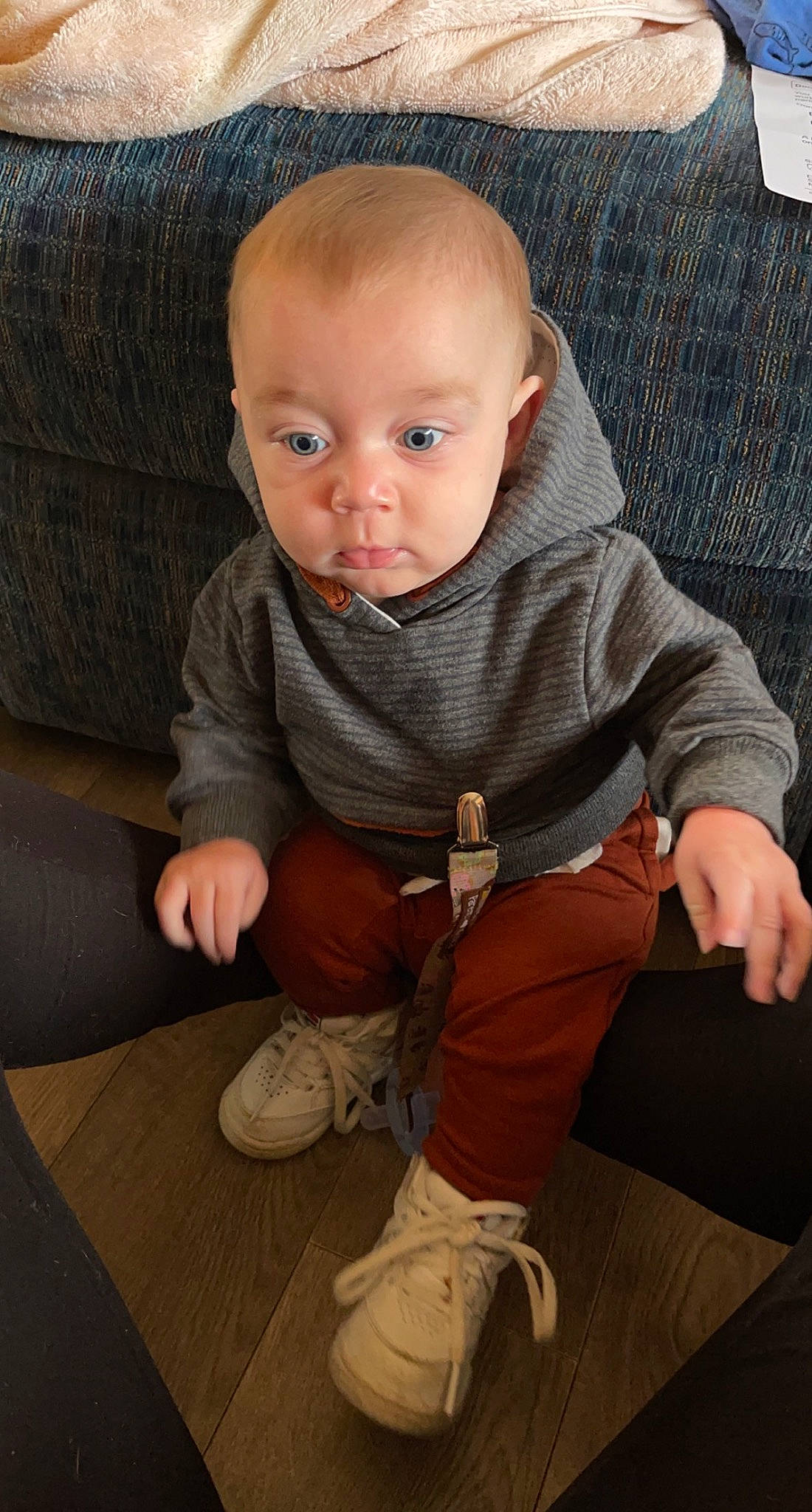 Rodney joined the competition — help win amazing prizes! baby, baby_toddler_clothing, chair, cheek, child, comfort, couch, floor, flooring, human_leg, iris, lap, leg, person, sitting, skin, sleeve, sneakers, sock, toddler