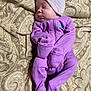 baby, bedtime, blanket, child, cozy, cute, face, hat, indoors, infant, newborn, onesie, paisley_pattern, peaceful, portrait, purple_clothing, resting, sleeping, soft, warm