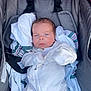 baby, blanket, blue_eyes, car_seat, child, clothing, comfort, cute, fabric, face, indoors, infant, newborn, onesie, person, resting, seatbelt, small, soft, stripes