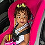 toddler, child, car_seat, pink, curly_hair, yellow_bow, sippy_cup, bread, car_interior, seatbelt, happy, smiling, white_tank_top, sitting, baby, cute, food, drink, young_child, indoors