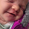 newborn, baby, infant, sleeping, face, portrait, close_up, cheeks, nose, mouth, eyes_closed, soft_blanket, jacket, magenta, pink, gray, clothing, cozy, indoors, photography