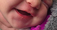 Aurora joined the competition — help win amazing prizes! newborn, baby, infant, sleeping, yawning, face, portrait, close_up, fuzzy_collar, purple_clothing, jacket, blanket, cozy, indoors, head, eyes_closed, nose, mouth, skin, candid