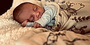 Roman is registered to the contest to win money with this photo: baby, sleeping, blanket, cozy, soft, infant, cute, rest, toddler, bedtime, warm, comfort, child, face, peaceful, plush, nursery, indoors, relax, portrait