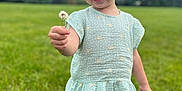 Avery joined the competition — help win amazing prizes! child, toddler, flower, green_grass, outdoor, smiling, shorts, shirt, nature, summer, trees, grass, happy, cute, person, pink_shoes, playful, daylight, casual_clothing, portrait