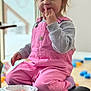 Avery joined the competition — help win amazing prizes! toddler, child, pink_overalls, gray_sweatshirt, indoor, snack, paper_plate, leather_ottoman, sitting, curious_expression, blond_hair, playroom, toys, soft_lighting, casual_clothing, face, hands, kneeling, home, portrait