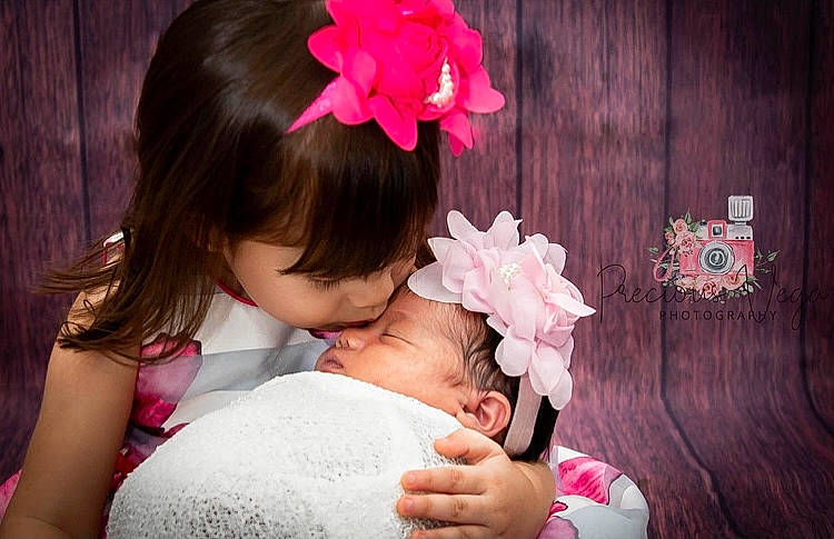 Haley joined the competition — help win amazing prizes! arm, black_hair, cheek, facial_expression, finger, flower, gesture, hair, hairstyle, hand, happy, headgear, human, lip, person, petal, pink, plant, red, skin