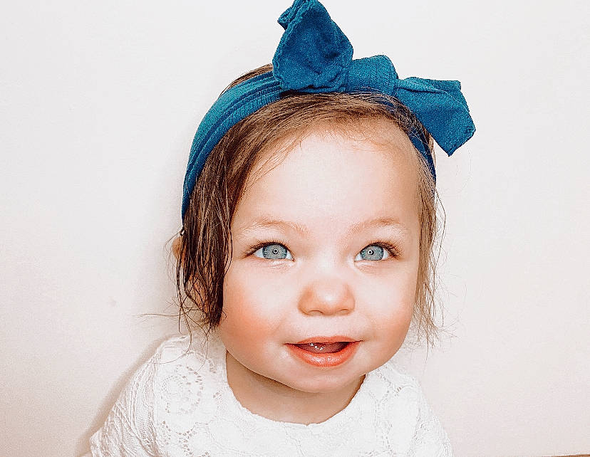 Esmae is registered to the contest to win money with this photo: baby, baby_toddler_clothing, cheek, child, child_model, costume_accessory, costume_hat, embellishment, eyelash, hair_accessory, headband, headgear, headpiece, iris, joy, lip, mouth, person, portrait_photography, toddler