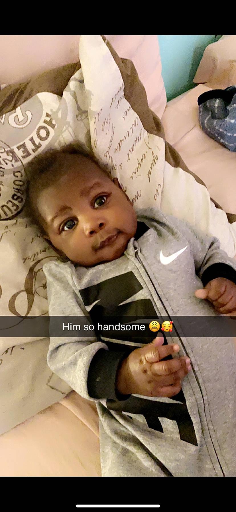 Ryjay is registered to the contest to win money with this photo: baby, baby_toddler_clothing, cheek, child, comfort, eyebrow, eyelash, face, finger, gesture, happy, head, linens, people, person, photo_caption, photograph, room, sleeve, smile