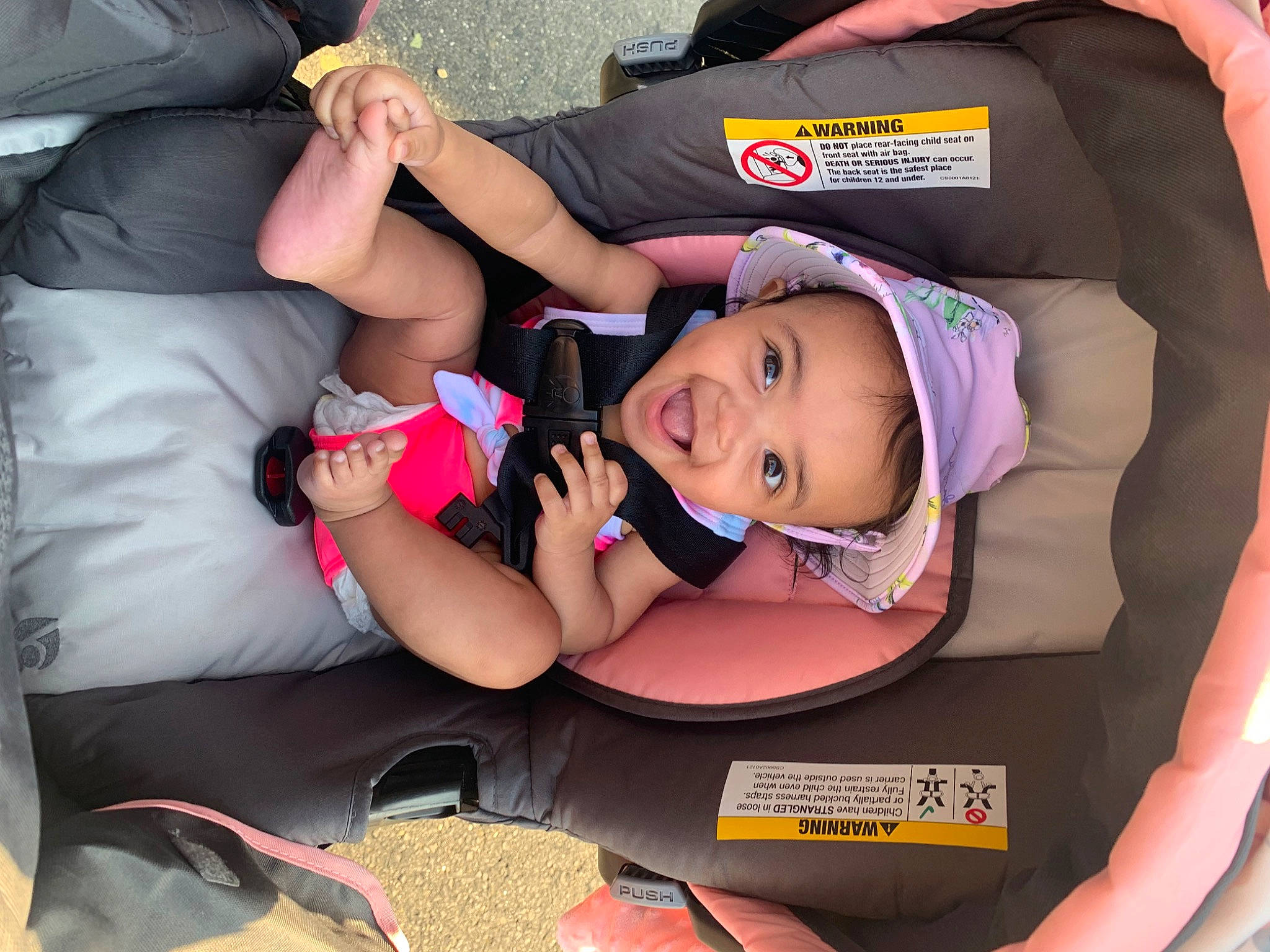 Marlani is registered to the contest to win money with this photo: arm, auto_part, baby, baby_carriage, baby_products, baby_toddler_clothing, bag, car_seat, carmine, child, comfort, fun, hand, hat, human_leg, joy, lap, mouth, person, sitting