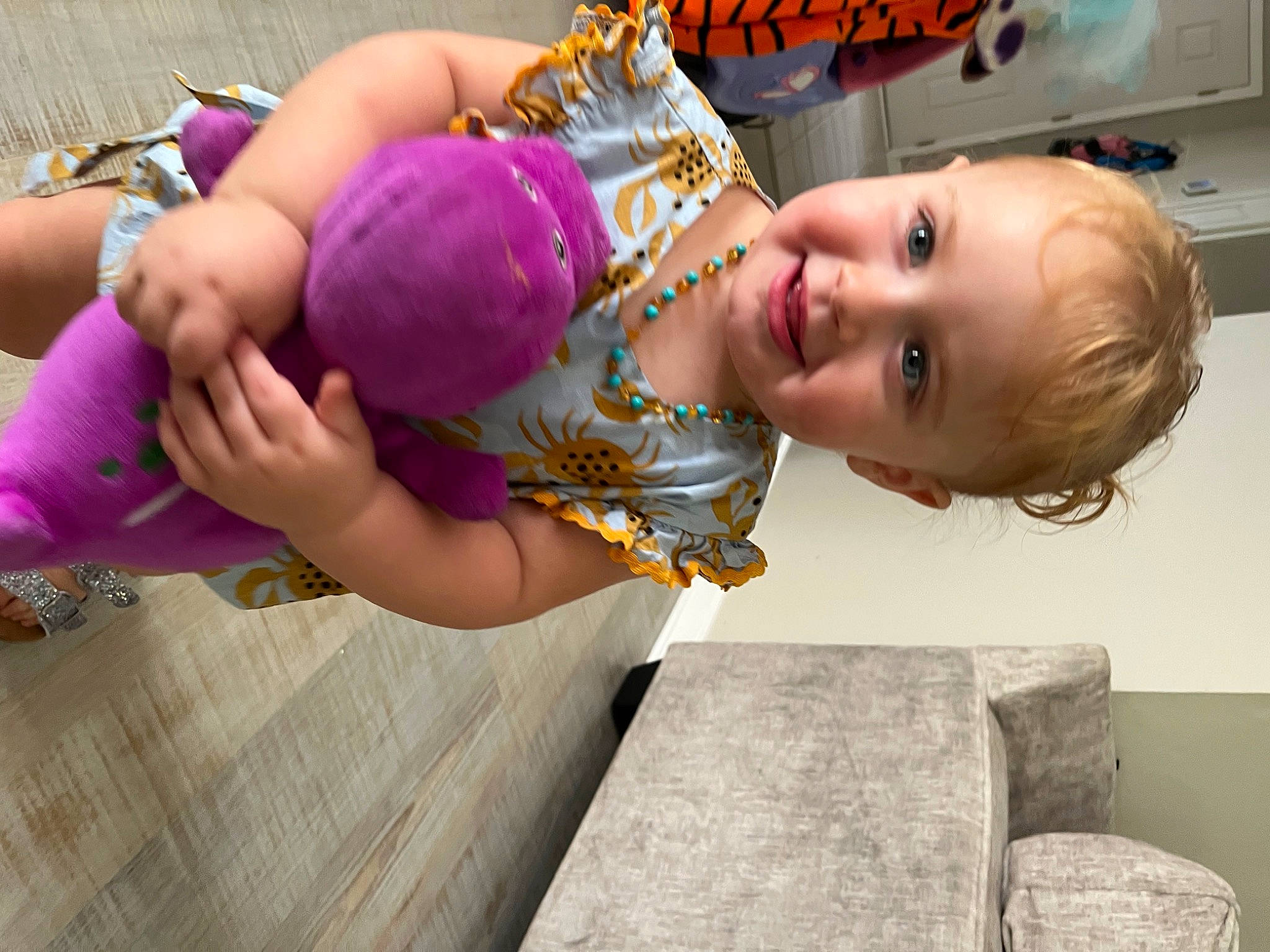 Lucy is registered to the contest to win money with this photo: abdomen, baby, baby_laughing, baby_toddler_clothing, balloon, child, fashion_accessory, fun, happy, head, joy, leisure, magenta, party_supply, person, play, recreation, smile, toddler, vacation