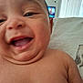 Ezra joined the competition — help win amazing prizes! baby, smiling, closeup, face, chubby_cheeks, chin_rolls, skin, torso, shoulder, indoor, couch, furniture, happy, cute, infant, person, young_child, portrait, expression, head