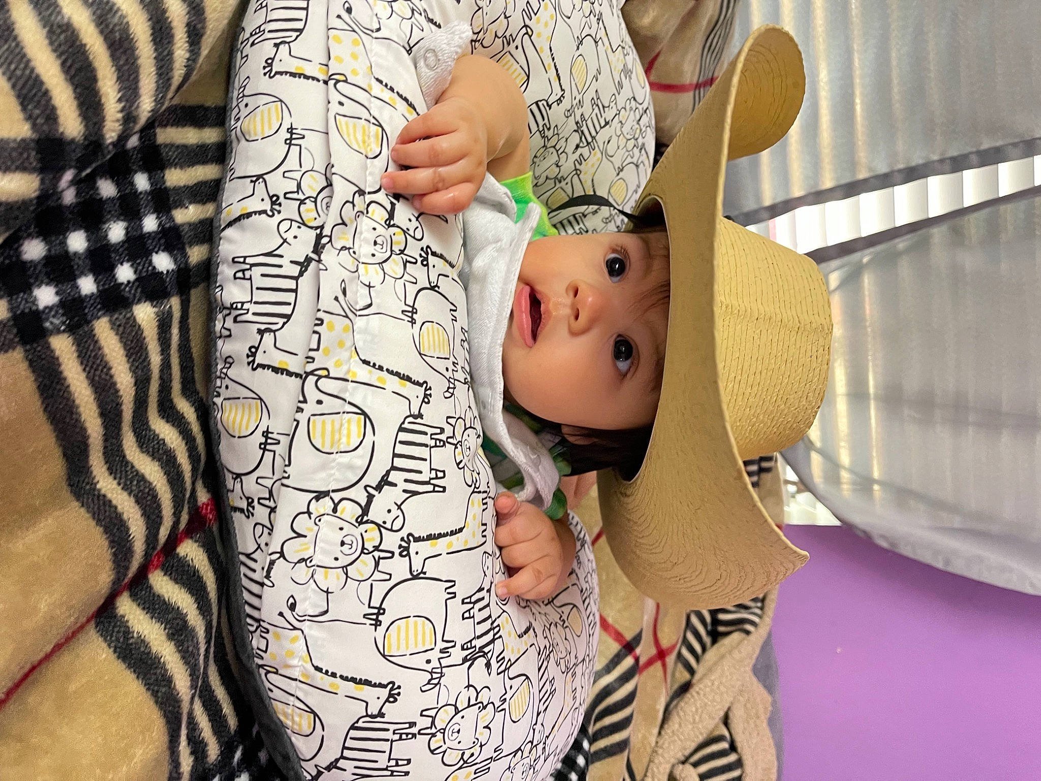 Daiyan is registered to the contest to win money with this photo: abdomen, baby, cap, chest, comfort, elbow, fashion_accessory, hat, headwear, human_leg, linens, pattern, person, sleeve, stuffed_toy, sun_hat, temporary_tattoo, textile, thigh, toddler