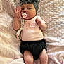 baby, infant, pacifier, headband, bow, blanket, pink, clothing, onesie, shorts, hand, face, lying_down, cute, soft, sleepwear, newborn, child, indoors, person