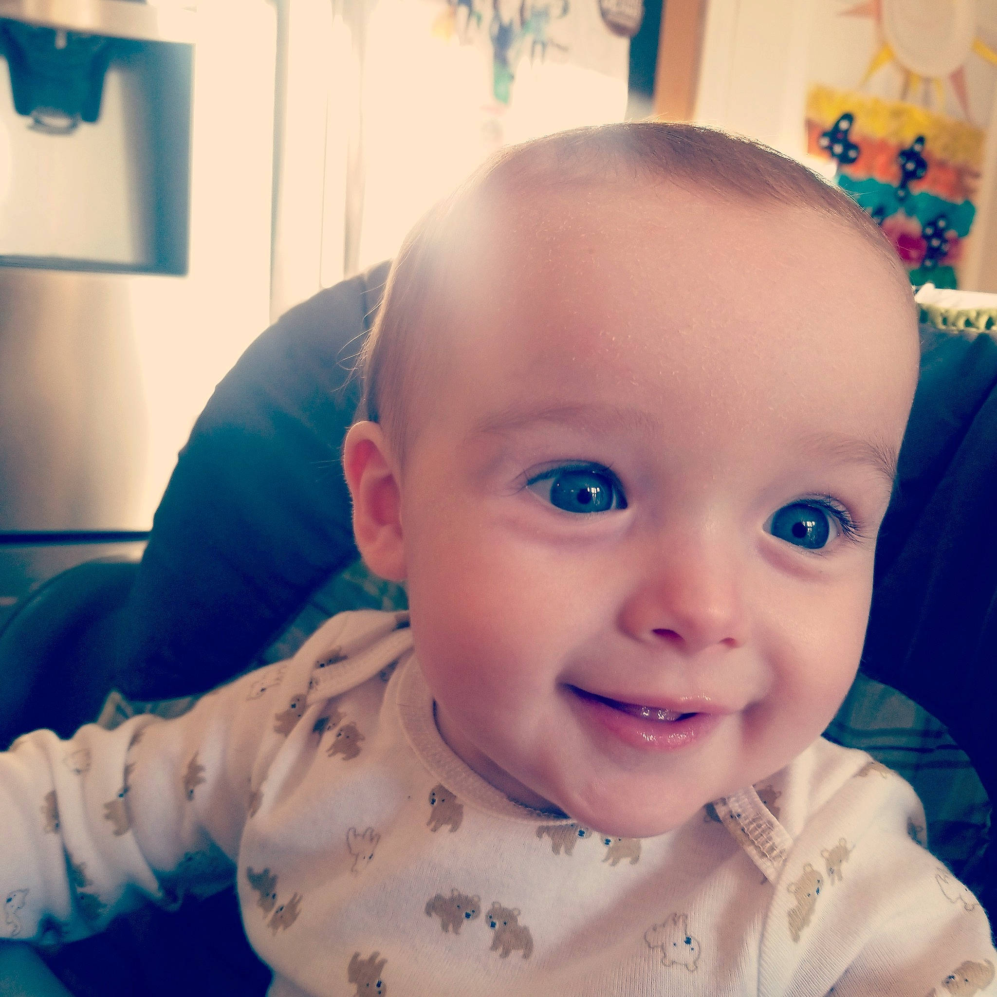 Julius is registered to the contest to win money with this photo: arm, baby, baby_toddler_clothing, cheek, ear, eye, eyelash, face, facial_expression, forehead, happy, iris, jaw, joy, lip, mouth, neck, nose, person, skin