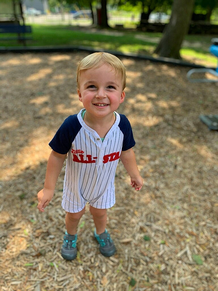 Luca is registered to the contest to win money with this photo: baby, baby_toddler_clothing, child, city, cool, footwear, fun, grass, happy, joy, leisure, people_in_nature, person, plant, play, recreation, skin, sleeve, smile, t_shirt