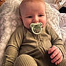 Cole joined the competition — help win amazing prizes! baby, infant, pacifier, blanket, sleepwear, ribbed_clothing, hand, face, skin, indoor, cozy, comfort, soft, child, cute, expression, person, young, relaxing, portrait