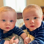 Canyon And Colter joined the competition — help win amazing prizes! baby, twins, infant, blue_eyes, striped_shirt, portrait, indoor, bed, blanket, closeup, cute, smile, hands, cheeks, skin, bokeh, soft_light, homedecor, person, lying_down
